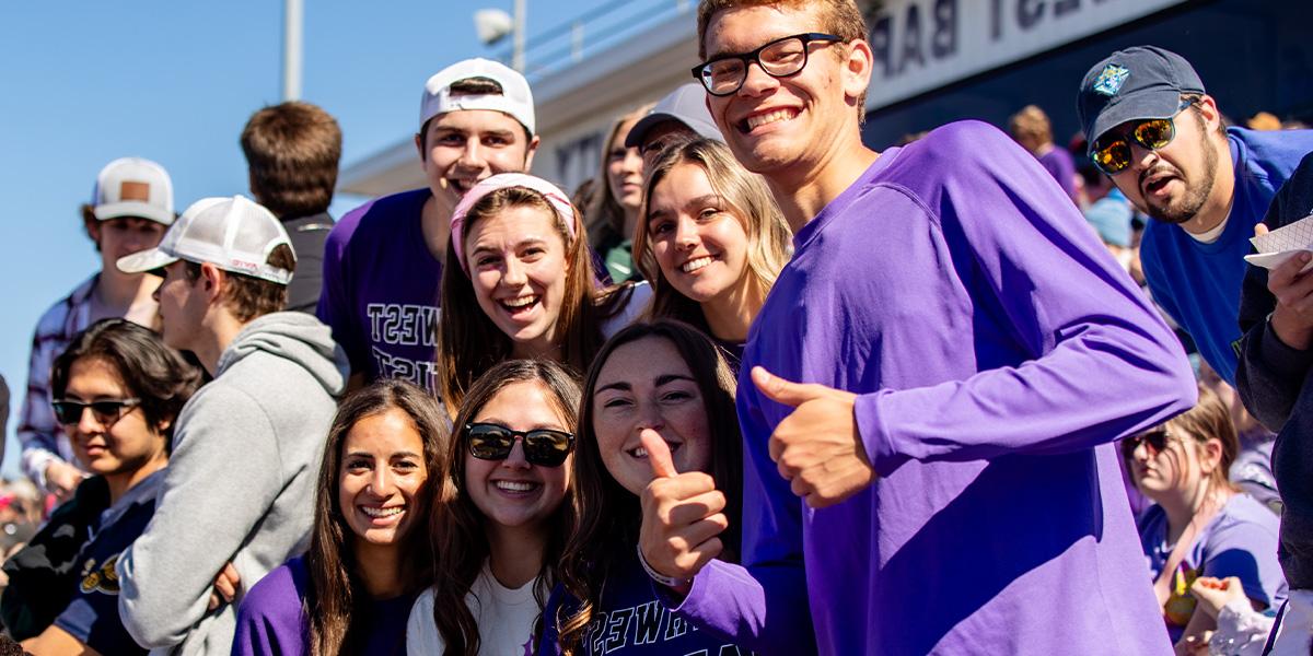 students gathered together at SBU football game